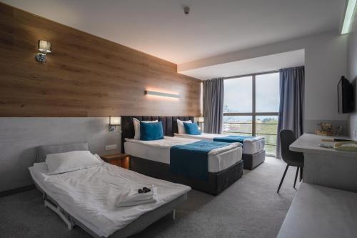 Ένα ή περισσότερα κρεβάτια σε δωμάτιο στο Havana Hotel - All Inclusive