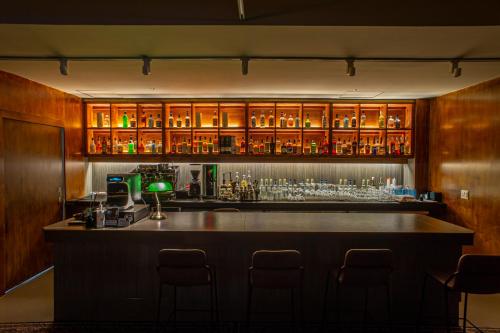 a bar with a lot of bottles and glasses at Glue Hotel in Seoul