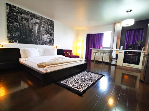 a bedroom with a bed and a living room at Sector 6 - Metrou Gorjului - Studio G by MRG Apartments in Bucharest