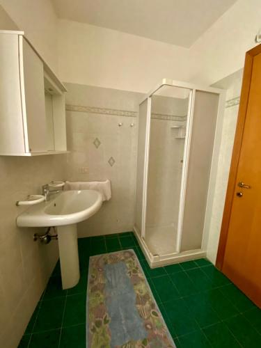 a bathroom with a sink and a shower at casa alla Valle in Salò
