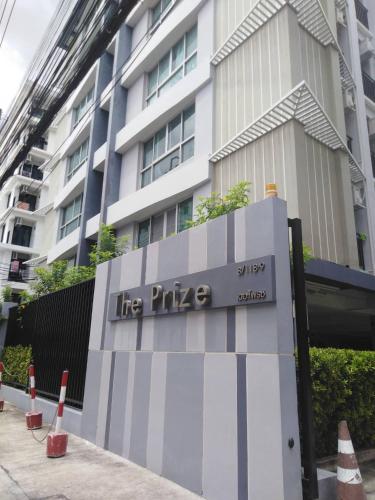 a sign for the pike in front of a building at THE PRIZE in Ban Yang