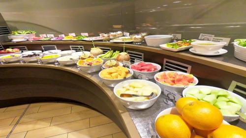 a buffet line with many different types of food at Holiday Inn & Suites Port Moresby by IHG in Port Moresby