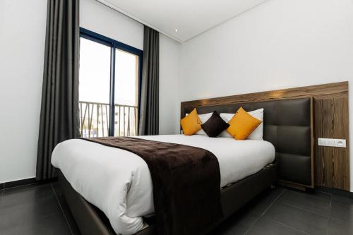 Voodi või voodid majutusasutuse Wazo Appart-Hôtel toas