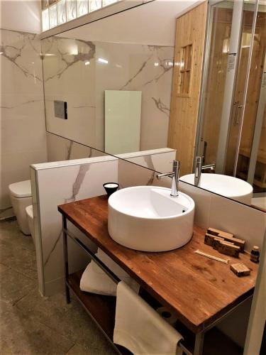 a bathroom with a sink and a mirror at Villa Ottocento in Campertogno