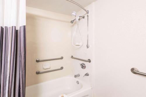 a shower in a bathroom with a shower curtain at La Quinta Inn & Suites by Wyndham San Antonio Riverwalk in San Antonio
