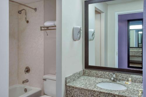 a bathroom with a sink and a mirror at La Quinta by Wyndham Minneapolis Bloomington W - FREE AIRPORT SHUTTLE in Bloomington