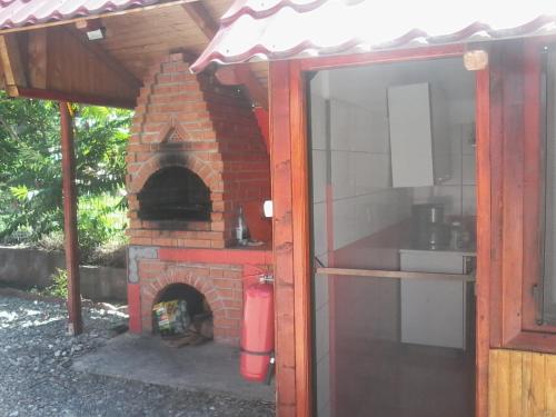 a brick oven with a stove in a yard at Complex Turistic Ocna Sibiului in Ocna Sibiului