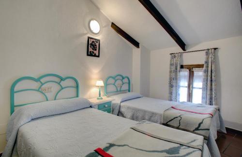 Een bed of bedden in een kamer bij La Casita