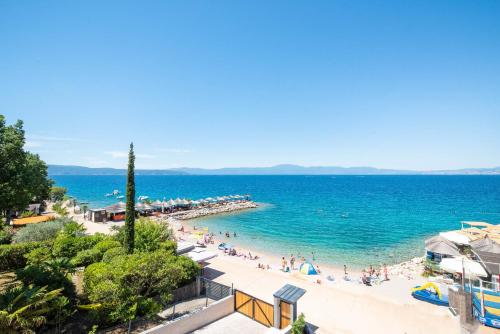 a view of a beach with people in the water at Villa Sunset Sea in Krk
