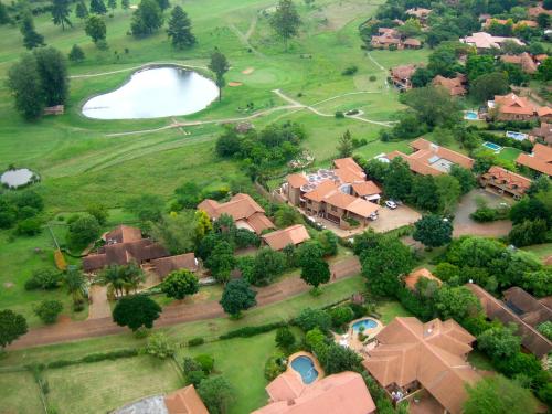 arial view of a house with a golf course at 7 Saint Andrew in White River