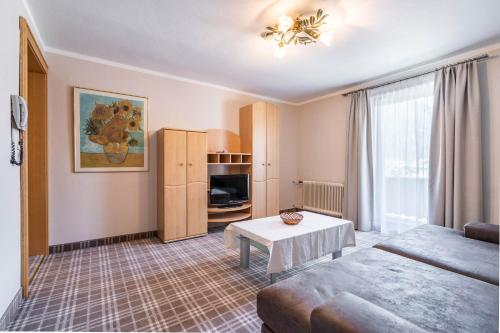 a living room with a couch and a table at Appartements Mair in Mayrhofen