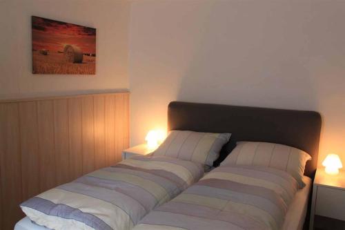 Postel nebo postele na pokoji v ubytování Ferienwohnung LEICHT