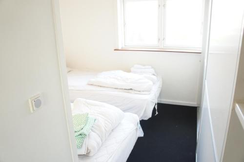 Posteľ alebo postele v izbe v ubytovaní Nørregade (ID 189)