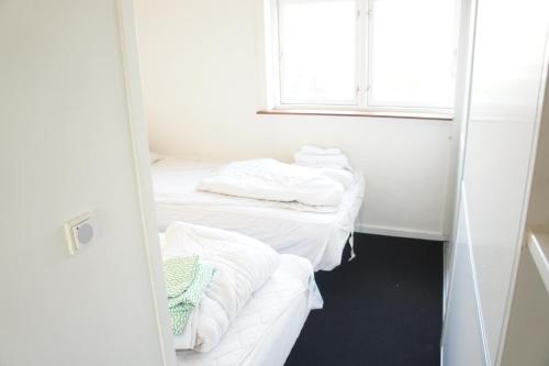 Postel nebo postele na pokoji v ubytování Nørregade (ID 189)