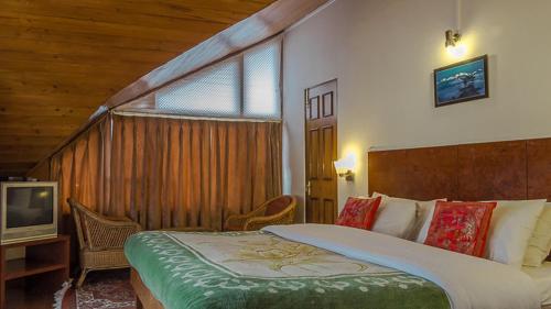 Postel nebo postele na pokoji v ubytování Hotel Shangrila Regency