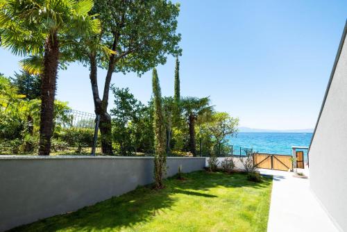 a view of the ocean from the balcony of a house at Villa Sunset Sea in Krk