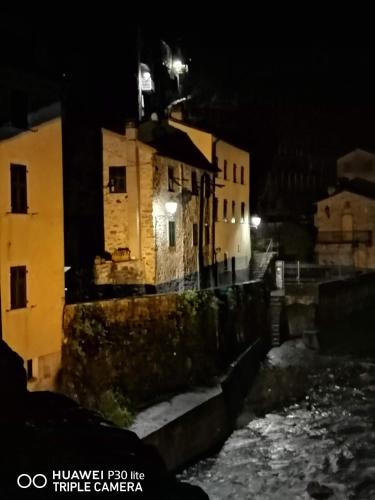 a group of buildings at night with snow on the ground at Casina Matilde in Varese Ligure