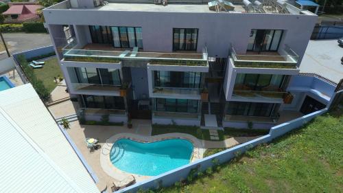 an aerial view of a house with a swimming pool at One Rodney Heights Condominiums in Gros Islet