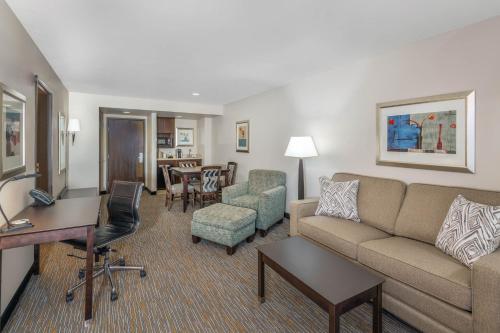 a living room with a couch and a table at Wingate by Wyndham - St. George in St. George