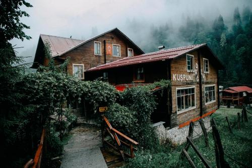 a wooden house in the middle of a forest at Kuşpuni Mountain Lodge in Ayder Yaylasi