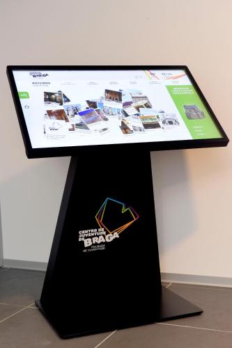 a computer screen on top of a black stand at HI Braga - Pousada de Juventude in Braga