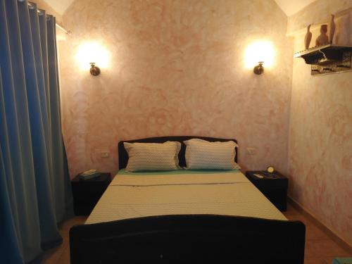 Voodi või voodid majutusasutuse Nouveau Bungalow Djerba toas
