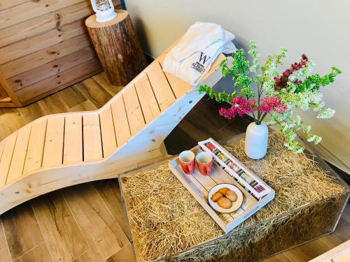 a bed with hay and a table with food on it at Agriturismo Casale ai Prati in Latisana