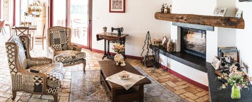 a living room filled with furniture and a fireplace at Agriturismo Casale ai Prati in Latisana