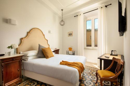 En eller flere senger på et rom på Guesthouse Serafino