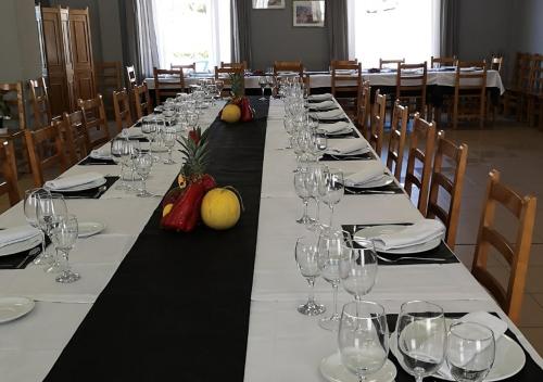 a dining room table filled with plates of food at Hotel Avenida del Sotillo in La Lastrilla