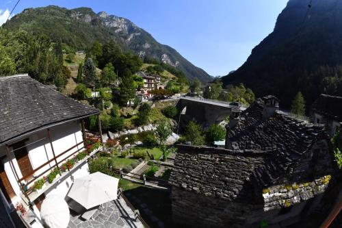 an aerial view of a village in the mountains at Rustico Luchessa Valle Verzasca in Lavertezzo