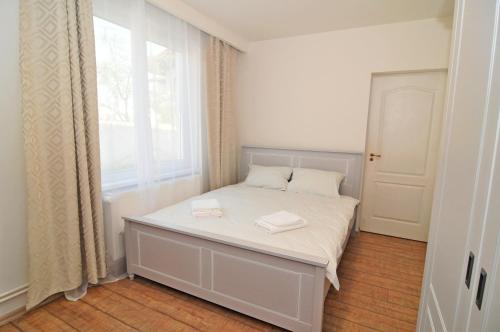 Apartament 7 Central tesisinde bir odada yatak veya yataklar