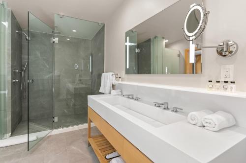 a bathroom with a sink and a shower at SA Carbon Beach Suites in Malibu