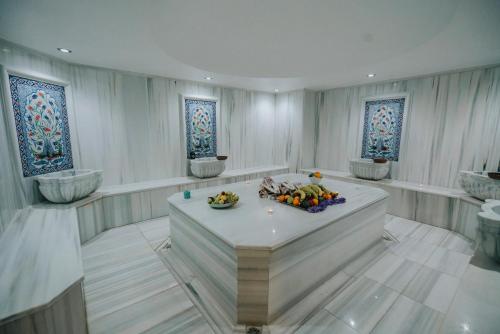 a room with a bowl of fruit on a table at 216 Castle Hotel in Gebze