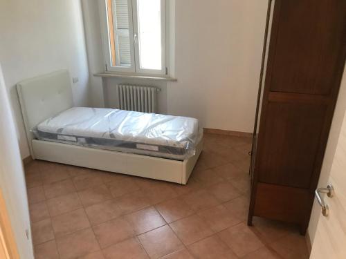a small bed in a room with a window at B&B Giulia in Parma