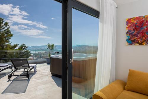 a living room with a sliding glass door at Villa 9 in Podstrana