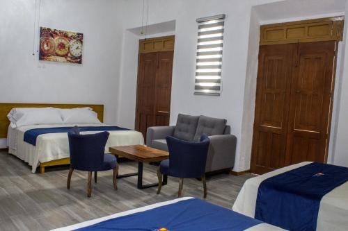 Postel nebo postele na pokoji v ubytování Hotel Real de Castilla Colonial