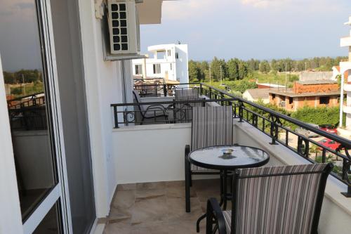 a balcony with a table and chairs and a view at METROPOLIS in Ulcinj