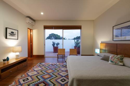 Voodi või voodid majutusasutuse Apartamentos West End toas