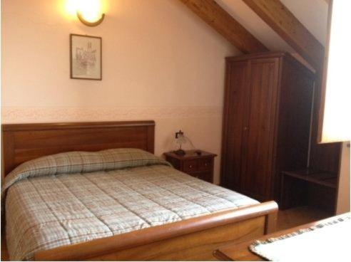 A bed or beds in a room at Ristorante Albergo da Giovanni