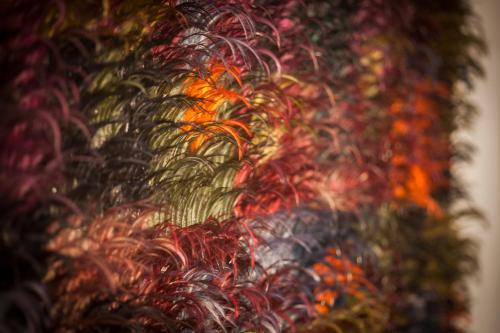 a close up of a painting with colorful threads at The Spire Hotel in Queenstown
