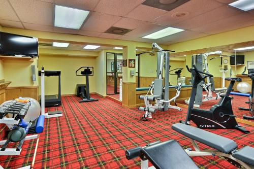a gym with treadmills and elliptical machines at Toftrees Golf Resort in State College