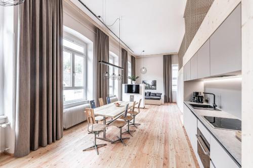 a kitchen and dining room with a table and chairs at NaturparkResort Alte Schule in Hieflau