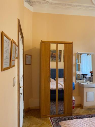a bedroom with a door leading to a bed at Hotel Gunia in Berlin