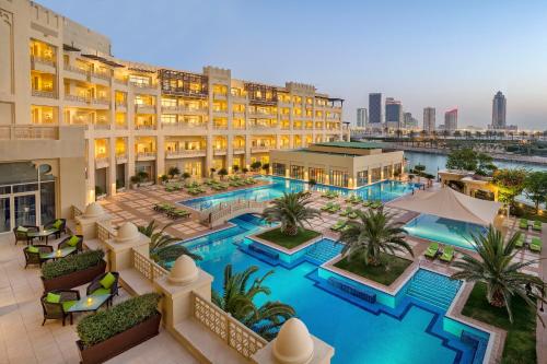 an overhead view of a hotel with a swimming pool at Grand Hyatt Doha Hotel & Villas in Doha