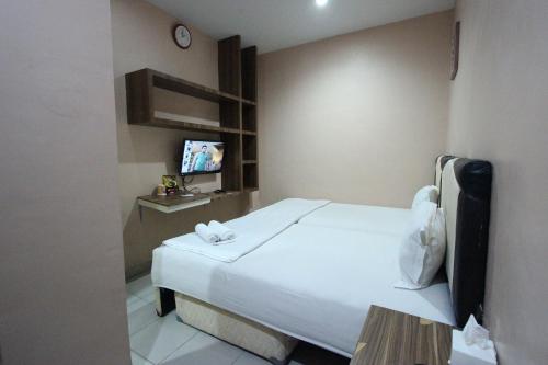 Postel nebo postele na pokoji v ubytování O2 Residence