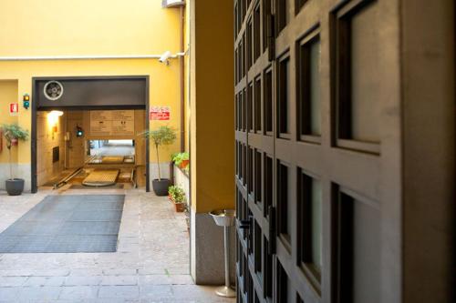 a hallway of a building with a door open at Hotel Mirage Sure Hotel Collection by Best Western in Milan