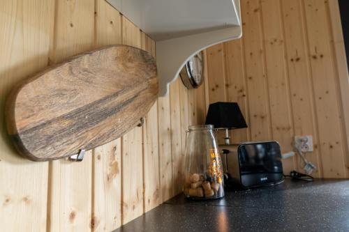a kitchen counter with a wooden spoon on the wall at Houses with a View#Sauna#Jaccuzi in Gozdowice