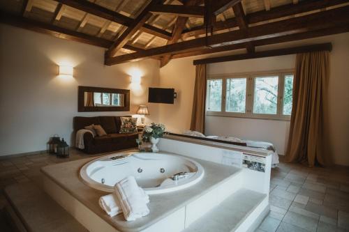 a large bathroom with a large tub in a room at Masseria Baroni Nuovi in Brindisi