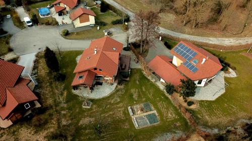 an overhead view of a house with a red roof at Chambre d'hôtes "LES CRETS" in Mercury